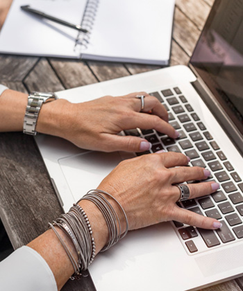 Woman typing on laptop